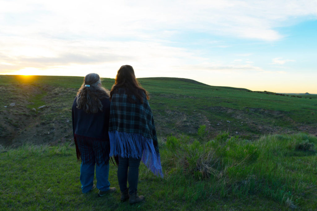 CSU Ethnic Studies professors Lindsey Schneider and Doreen Martinez look out over the land at Soapstone Prairie Natural Area.